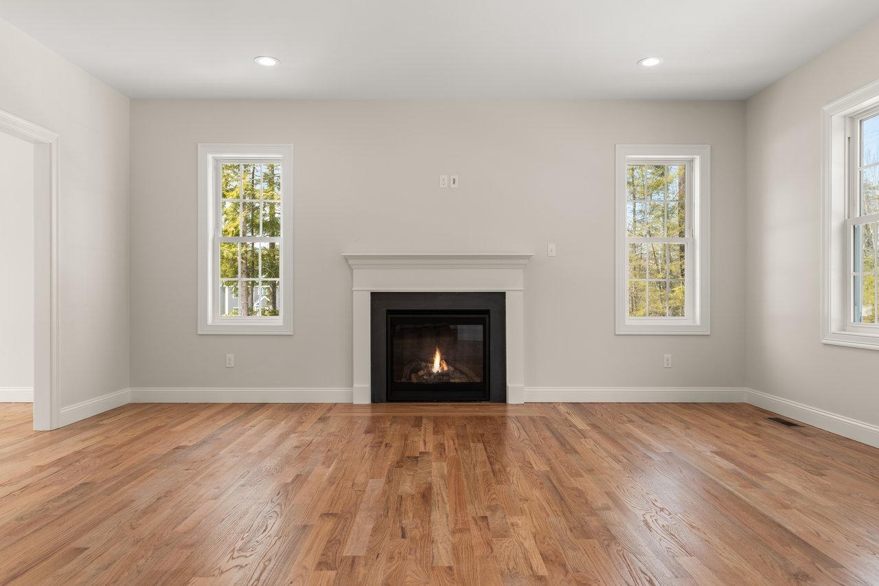 Gas log fireplace in the family room w 9 foot ceiling, a standard for all the new construction homes