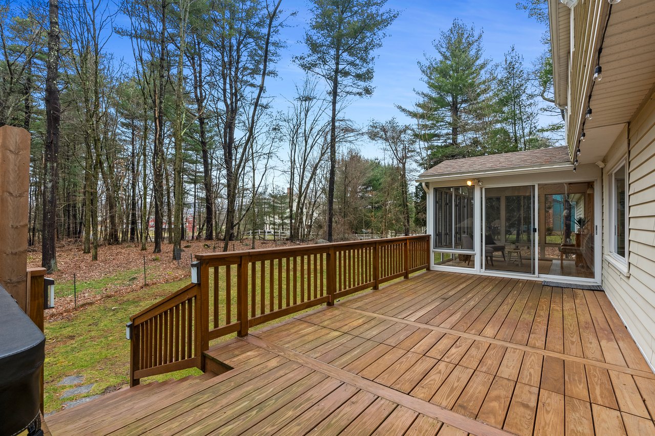 Deck leading to the yard and sunroom