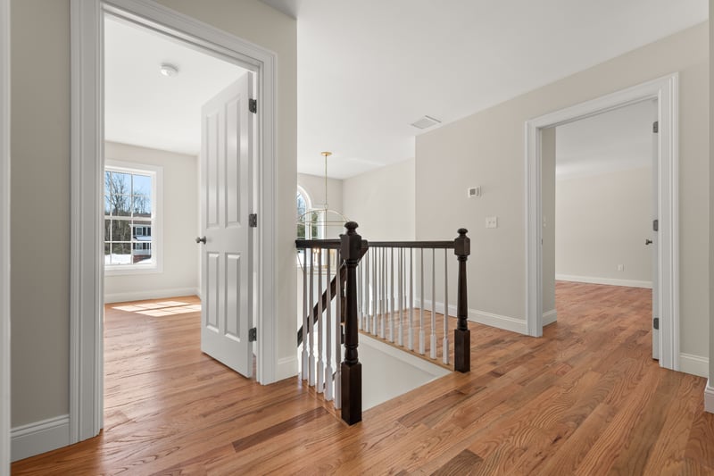 Overlook from second floor to the two story foyer