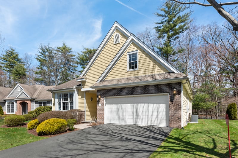 Two car garage with beautiful landscaping