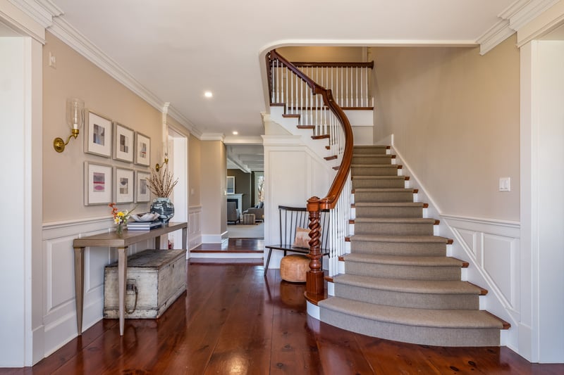 This soaring staircase welcomes you into this gracious home.