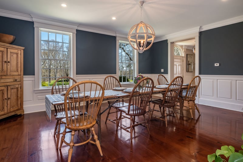 Formal dining is available. These wide pine floors really shine, the wainscotting  adds elegance to this space.