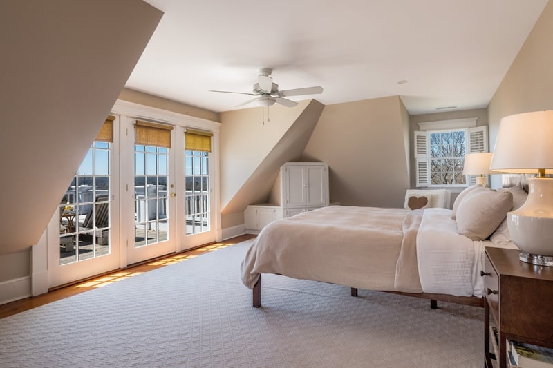 The primary bedroom has french doors that open to the best views.