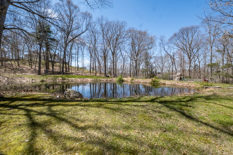 Private pond with park like surround