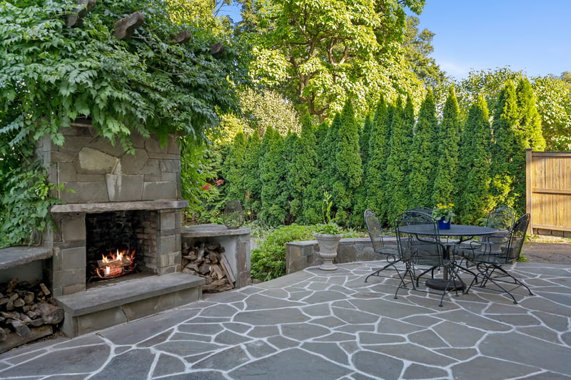 Shared stone patio with fireplace	