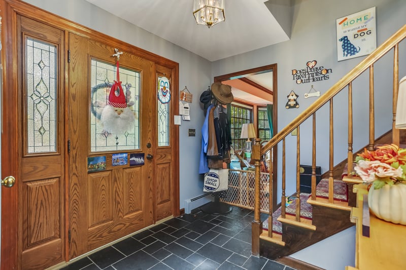 Looking toward the front door in the large entry hall