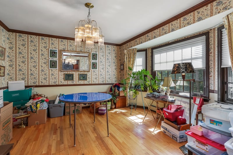 The Formal Dining Room with bay window and plenty of wall space for furniture placement.	