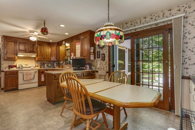 Large Dining Area with sliders to deck and Screen Porch.