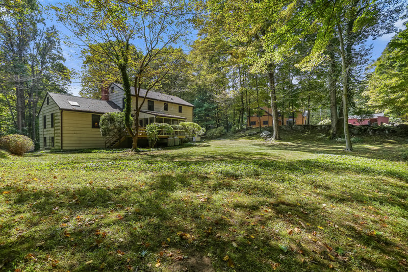 Rear view of the house with its level and expansive yard