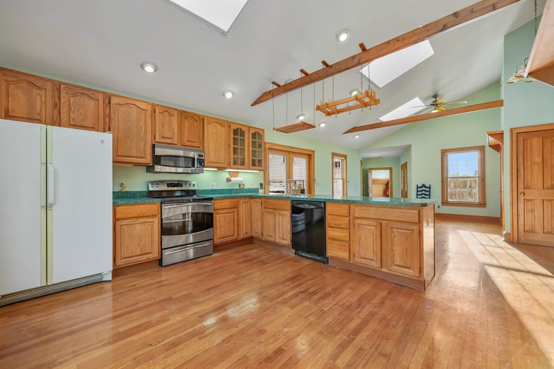 The vaulted ceilinged great room/kitchen area is graciously large and accommodating for many people.