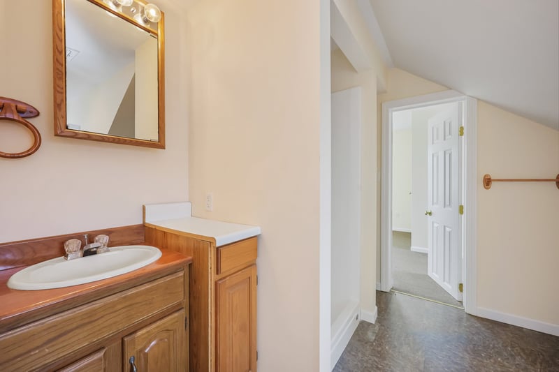 Full bath with a shower in the apartment space.