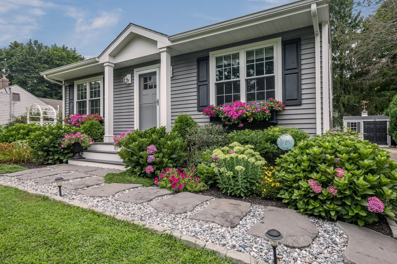 Beautiful perennials enhance the front of the house.